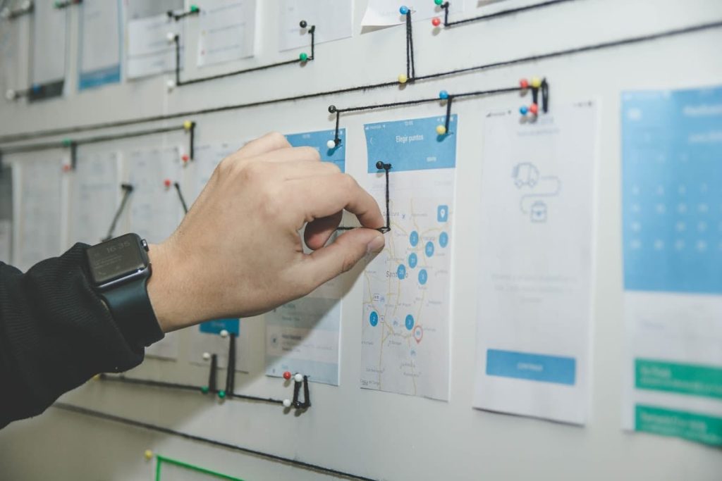 Marketing strategists planning a customized growth funnel strategy on a whiteboard