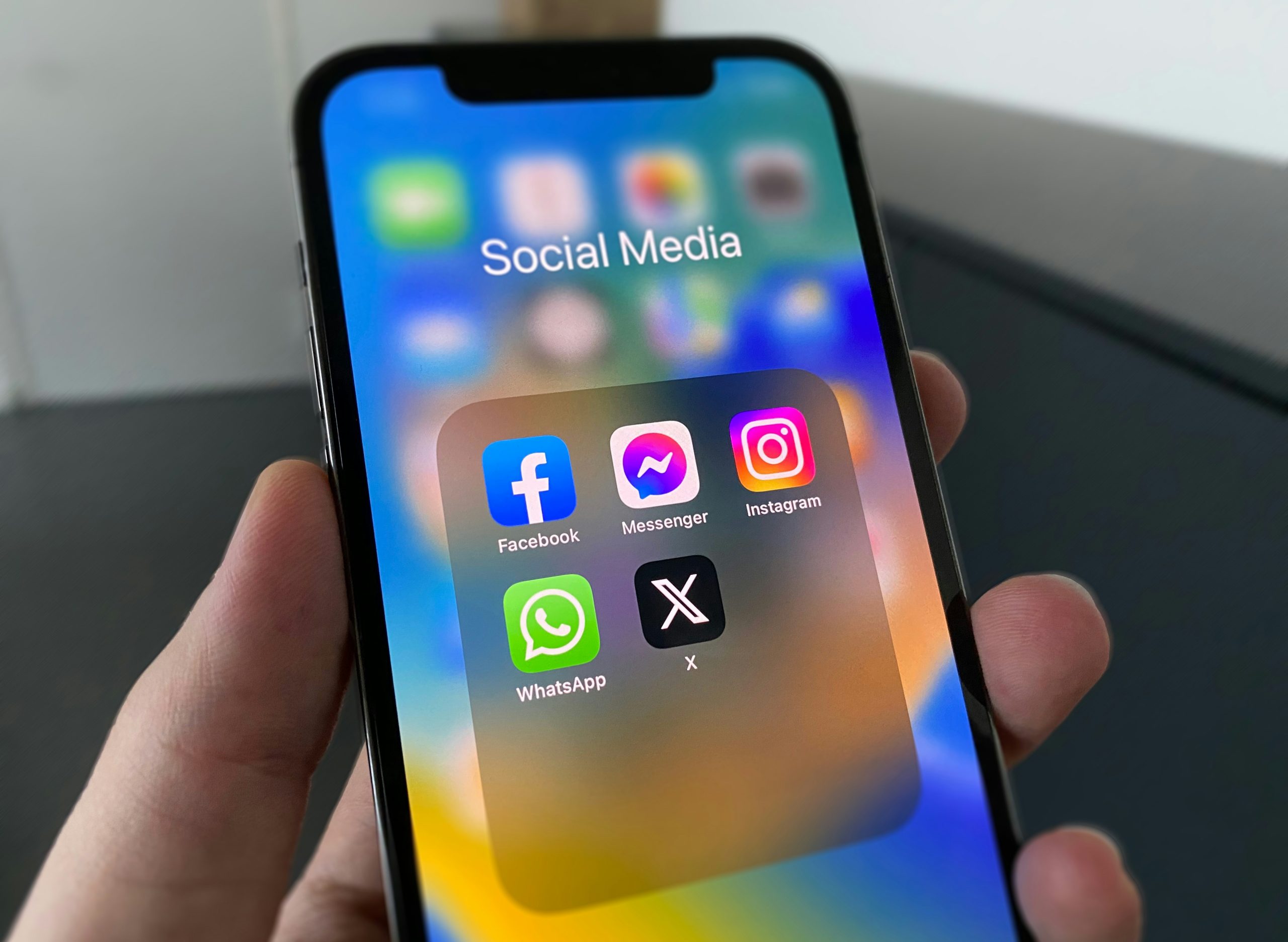 Close-up view of social media app icons displayed brightly on a mobile smartphone screen