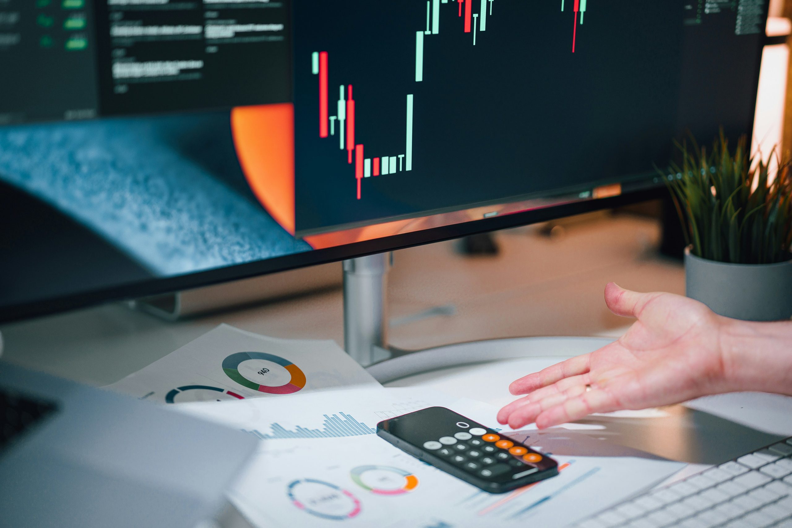Business professional analyzing analytics charts and marketing performance on a desktop computer